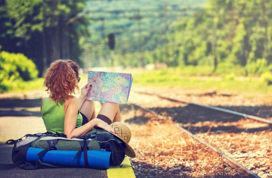 woman holding a map on travel